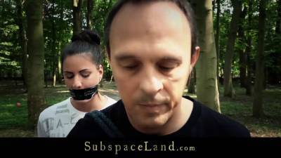 Busty brunette is bound and fucked hard in the woods - bdsm.one