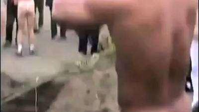 Asian bodybuilder barely covered at the beach - nvdvid.com