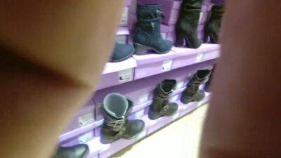 Trying heels and boot in a store - voyeurhit.com