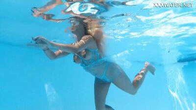Her Body Cutting Through The Shimmering Water Of The Pool - upornia.com