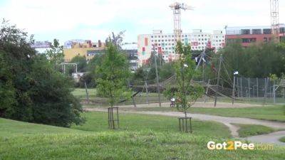 Blonde hottie sprays her stream outside in a close-up view - sexu.com