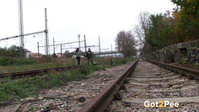 Brunette girls get desperate for a public pee session in the railway - sexu.com - Czech Republic