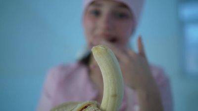 Young nurse and her banana - hclips.com