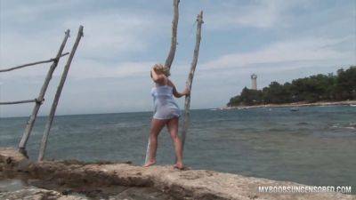 Busty teen Malina get wetting in waves - sexu.com