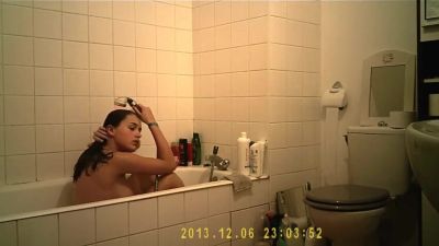 Brunette cutie enjoys a hot shower in the bathroom - voyeurhit.com