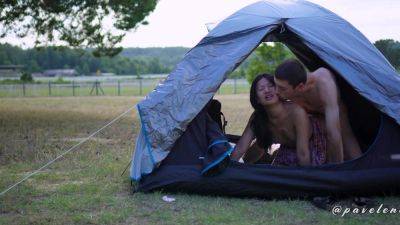 Asian chick is fucking with her boyfriend in a tent outdoors - anysex.com