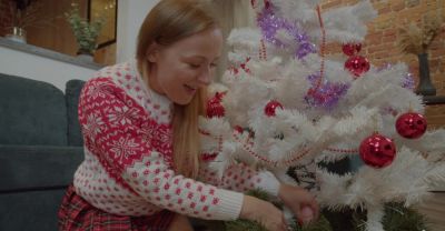 MILF in miniskirt rocks Santa hat while pleasuring herself with a festive dildo on the couch - alphaporno.com