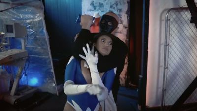 Brunette superheroine in blue mask stripped down under surveillance - yesvids.com
