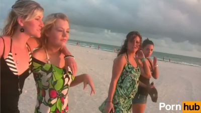 Two tan brunette women playfully expose themselves on a quiet beach - yesvids.com