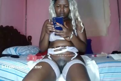 Dark-skinned cam girl in fishnet lingerie squirts on her bed during a solo show - yesvids.com