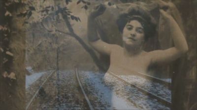 Curated vintage erotica unfolds along a snow-covered railway in moody archival stills - yesvids.com