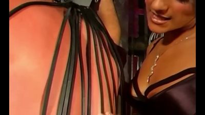 Mistress Delilah commands her leather-clad submissives in a dungeon session - yesvids.com