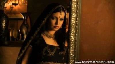 Indian brunette MILF teases with a slow striptease in golden-lit elegance - yesvids.com - India