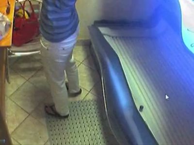 Lone figure caught on hidden cam inside glowing solarium - yesvids.com
