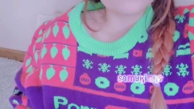 Young woman in festive sweater explores herself on the carpet - yesvids.com