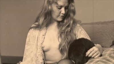 Vintage blonde receives oral sex from shirted man on a patterned bed - yesvids.com