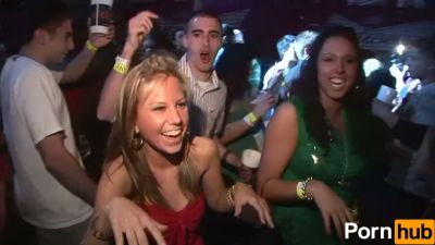 Two wild party girls in lingerie tease the crowd at a neon-lit nightclub - yesvids.com