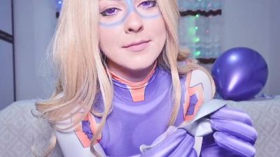 Blonde in purple latex superheroine costume plays with a silver balloon on a patterned bed - yesvids.com - Japan - Poland