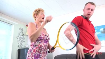 Amateur encounter between a blonde housewife and her young tennis instructor escalates in the living room - yesvids.com