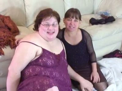 Curvy glasses-wearing woman pleasures her partner with a strapon in intimate setting - yesvids.com