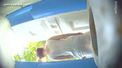 Two blonde women caught on hidden camera as one begins to urinate in a blue-tiled room - yesvids.com