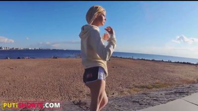 Blonde in athletic shorts spreads for a tattooed man on a white leather couch - yesvids.com