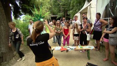 Artistic body painting and festival performances captured in vivid scenes - yesvids.com