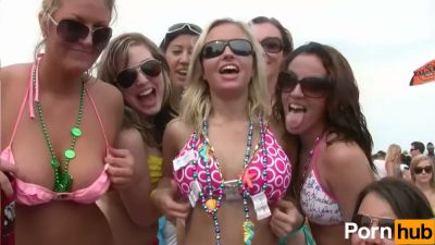 Blonde lesbians kiss and embrace at a crowded beach party in matching bikinis - yesvids.com