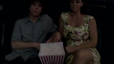 Mature brunette gives a stealthy handjob in a dark cinema - yesvids.com