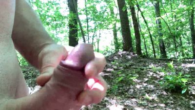 Man hikes naked through the forest while edging with his hand on his cock - yesvids.com