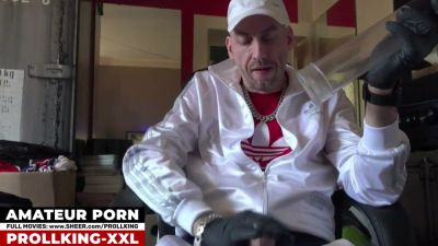 Man in cap and gloves tests a transparent device on his erect cock in a red-walled room - yesvids.com - Germany