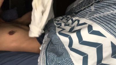 A man teases with a visible bulge in tight blue shorts before bed - yesvids.com