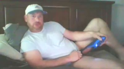Bearded man explores his limits with a blue phallic toy in bed - yesvids.com